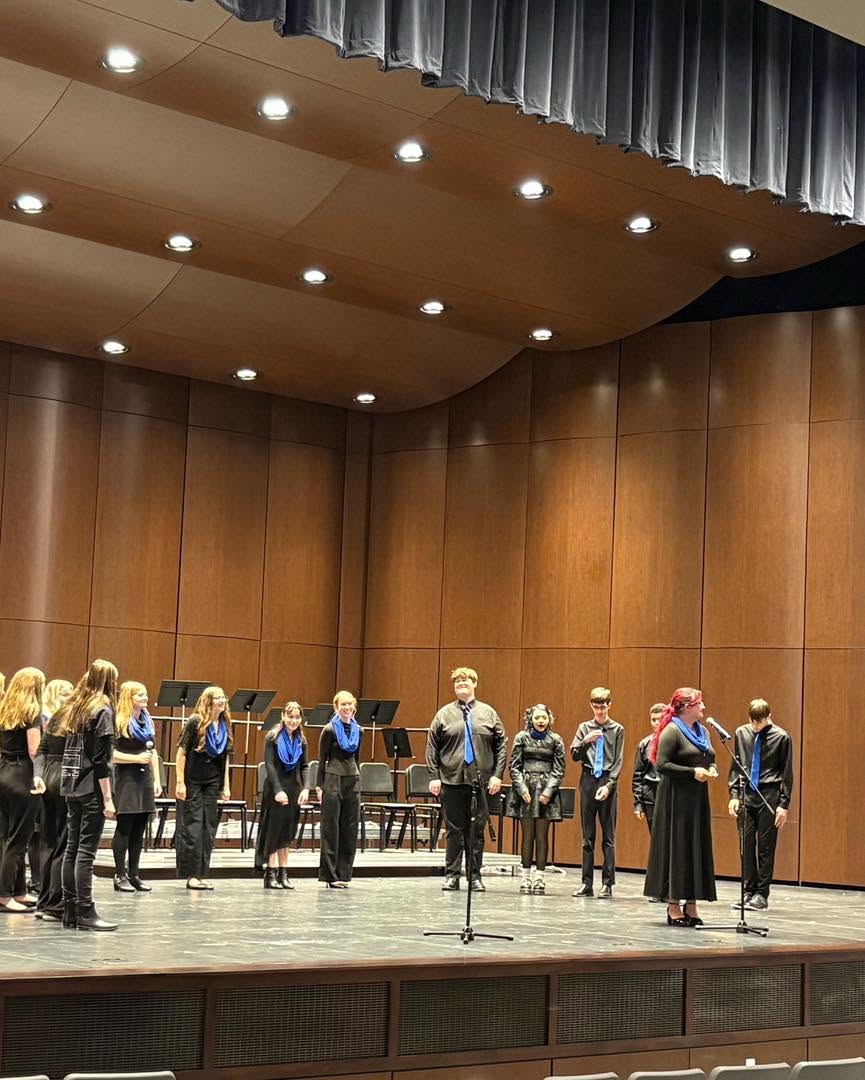 EHS choir students performing on stage.